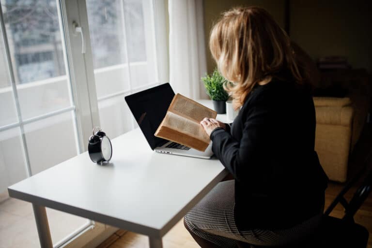 Guest booking directly on a laptop with coffee