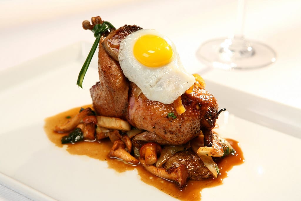 Chef-plated multi-course dinner in a suite